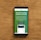A smartphone displaying an advertisement for an online trading platform called eToro. The screen shows a green background with text promoting the platform as a leading social trading platform. A button labeled 'Get Started' is visible, along with a partial view of a mobile app screen below.